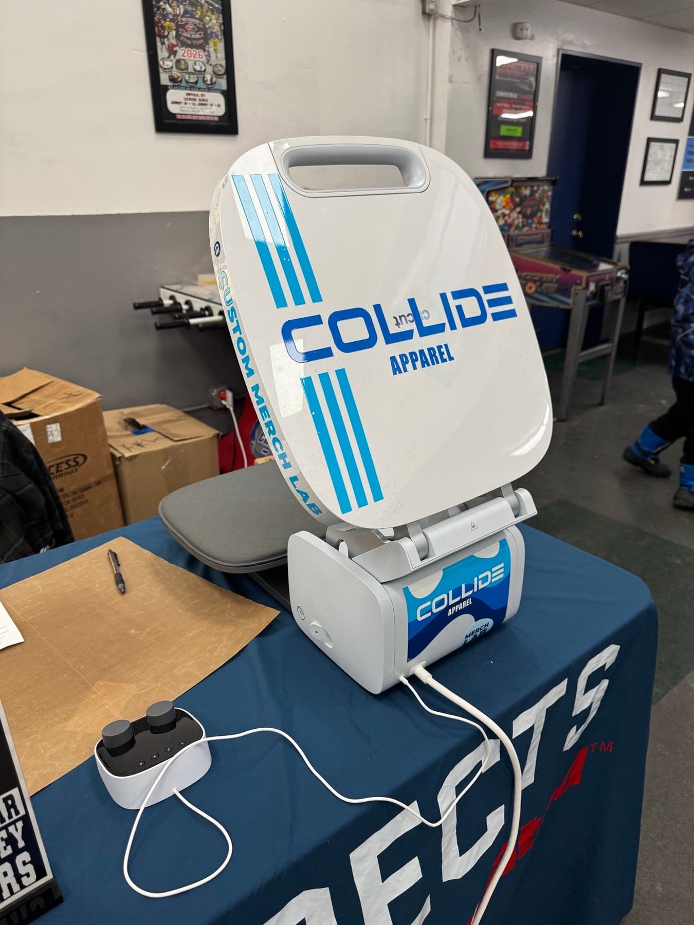The Collide Apparel heat press at the booth