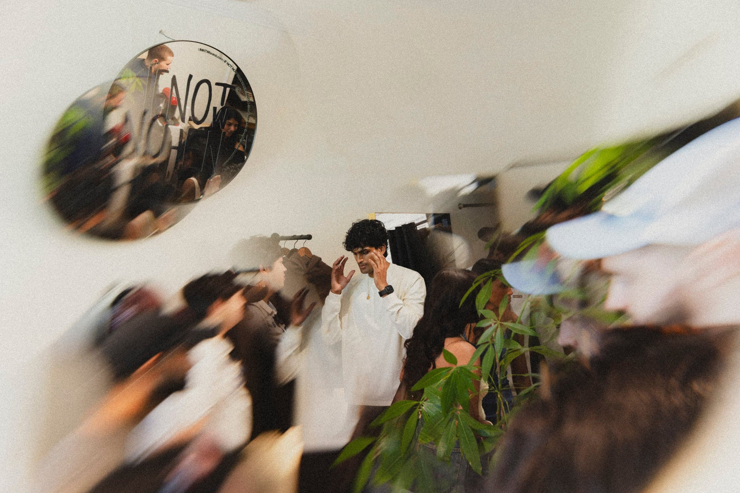 The pop-up crowd blurred around the lockup mirror